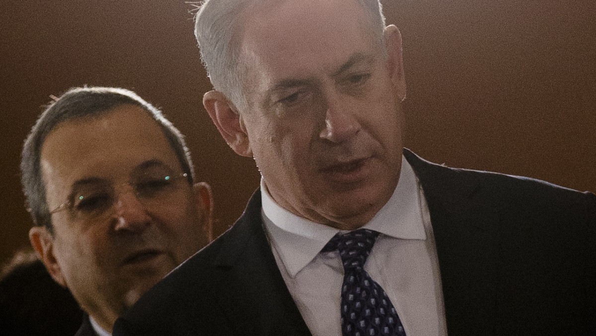 The Prime Minister of Israel, Benjamin Netanyahu, right, and Defense Minister Ehud Barak arrive at the plenary meeting during inter-governmental talks between Germany and Israel at the chancellery Berlin, Thursday, Dec. 6, 2012. (AP Photo/Markus Schreiber)