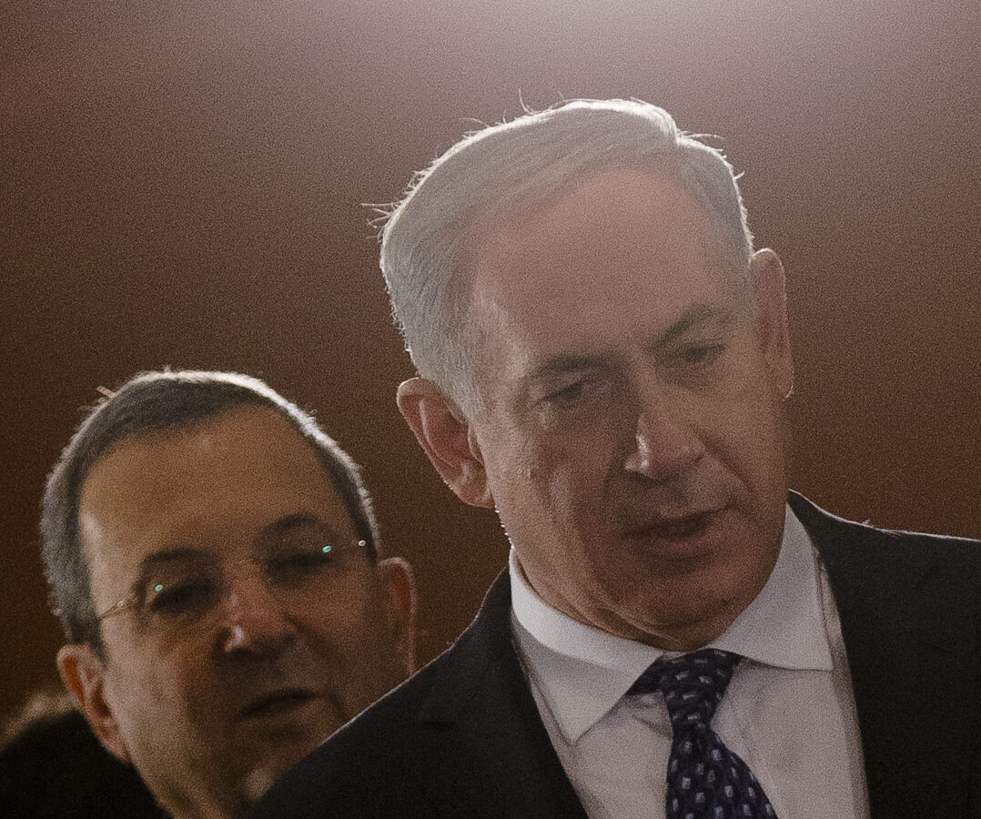 The Prime Minister of Israel, Benjamin Netanyahu, right, and Defense Minister Ehud Barak arrive at the plenary meeting during inter-governmental talks between Germany and Israel at the chancellery Berlin, Thursday, Dec. 6, 2012. (AP Photo/Markus Schreiber)
