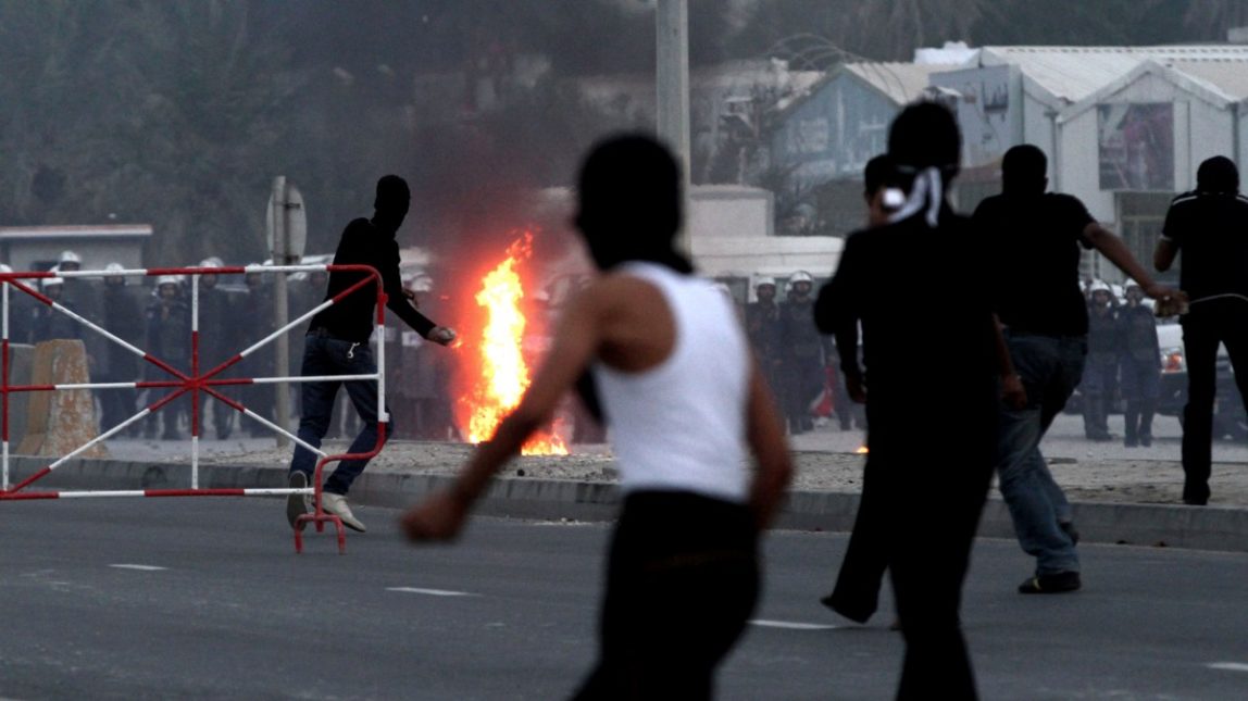 Bahraini anti-government protesters clash with riot police in Manama, Bahrain, Monday Nov. 26, 2012. (AP Photo/Hasan Jamali)