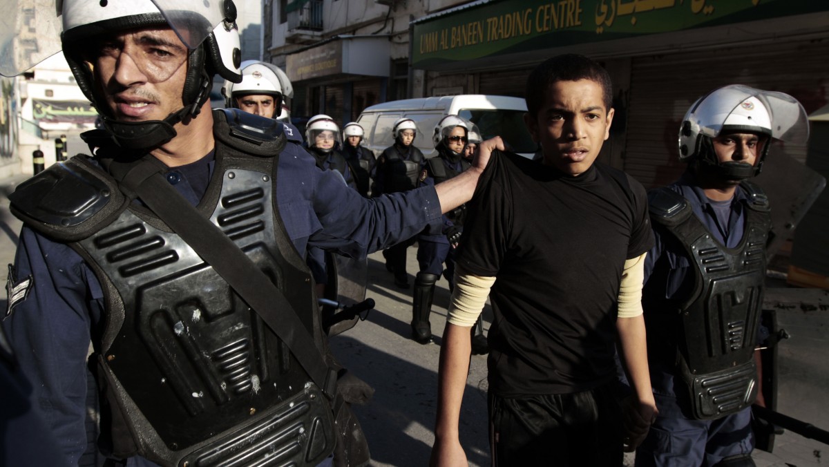 Riot police detain a Bahraini anti-government protester in Manama, Bahrain, Monday, Dec.17, 2012. (AP Photo/Hasan Jamali)