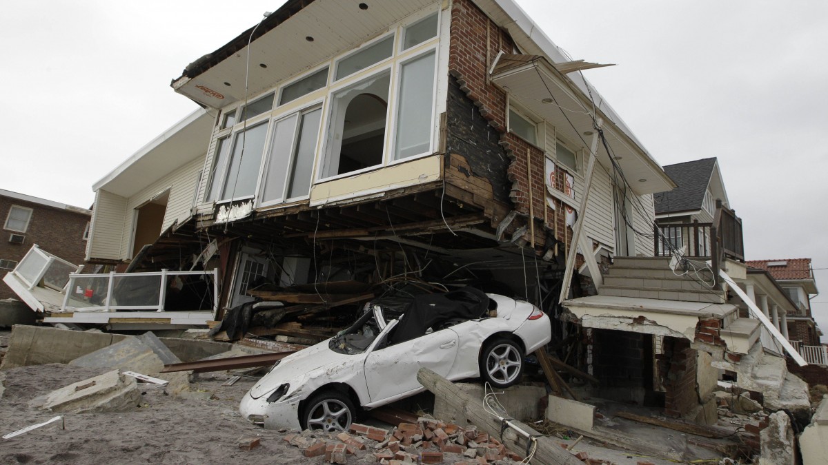 In this Nov. 19, 2012 file photo, a beachside house, deemed uninhabitable by the New York City Department of Buildings, is left in ruins in the Belle Harbor neighborhood of the Rockaways, in New York. (AP Photo/Kathy Willens, File)