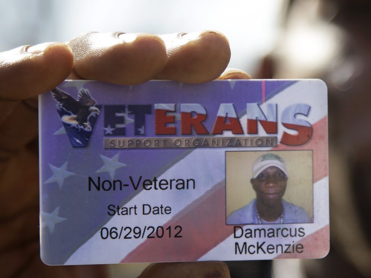 In this Nov. 29, 2012 photo, Damarcus McKenzie shows the identification card he was issued when working for the Veterans Support Organization in Nashville, Tenn. (AP Photo/Mark Humphrey)