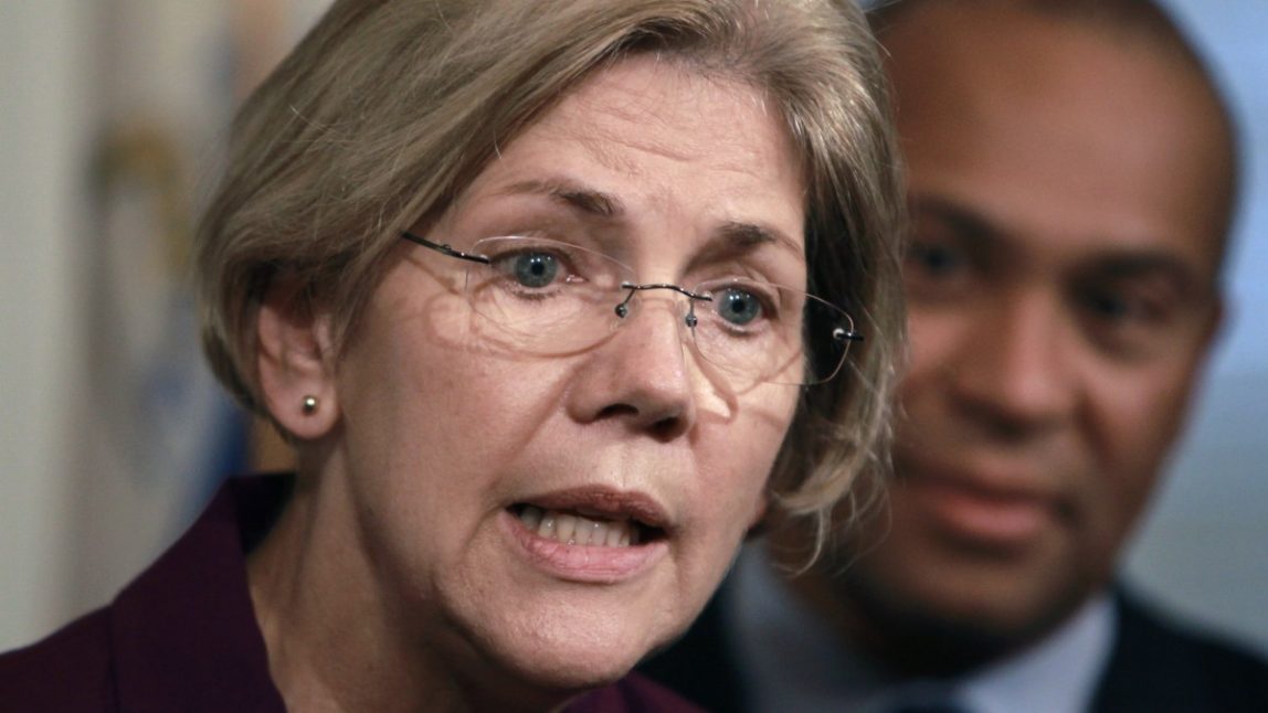 FILE - In this Thursday, Nov. 8, 2012, file photo, U.S. Sen.-elect Elizabeth Warren, D-Mass., left, faces reporters(AP Photo/Steven Senne, File)