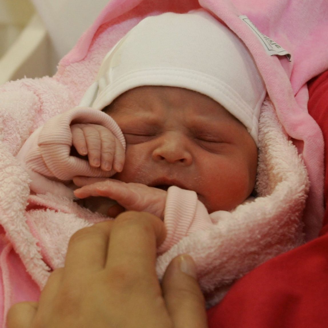 A newborn baby is seen on Tuesday, Oct. 18, 2005. (AP Photo/Pool/Maartje Blijdenstein)