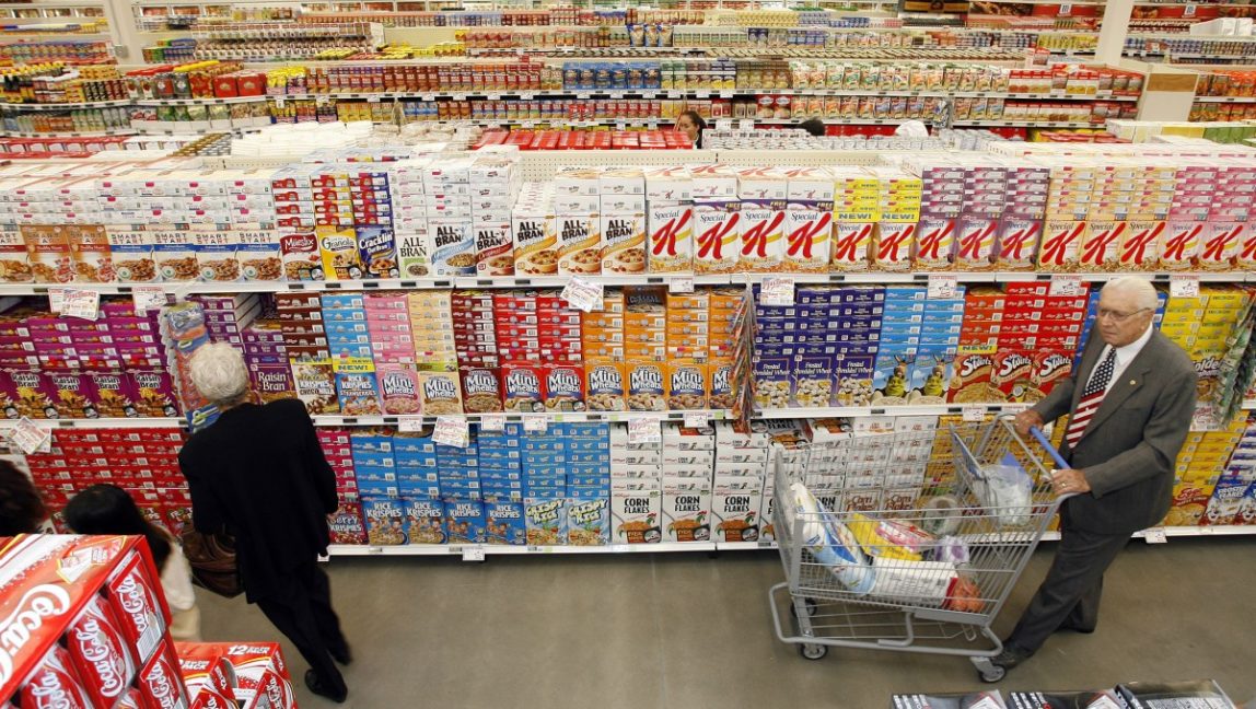 Shoppers tour the cereal aisle at a grocery store on April 20, 2007. (AP Photo/Denis Poroy)