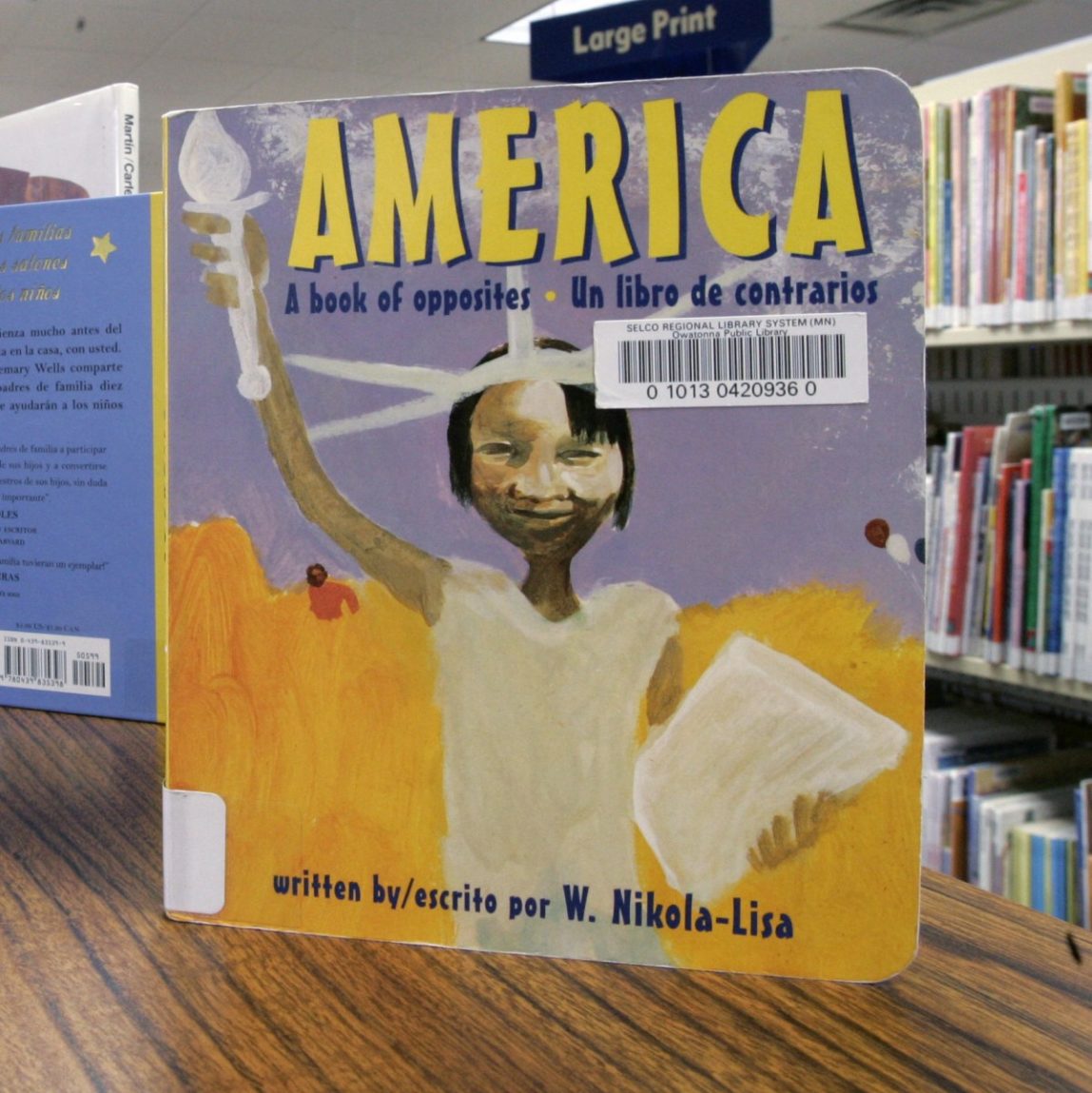 Children's books in several languages are displayed at the Owatonna Public Library in Owatonna, Minn., Tuesday, April 10, 2007. (AP Photo/Ann Heisenfelt)