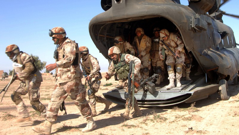 In this handout photo released by the U.S. military, Iraqi Army Soldiers of 4th Iraqi Army Division exit a U.S. CH-47 Chinook helicopter in support of Operation Swarmer in Samarra, Iraq,in this file photo from March 16, 2006. (AP Photo/ U.S. Army, Sgt. 1st Class Antony Joseph,File)