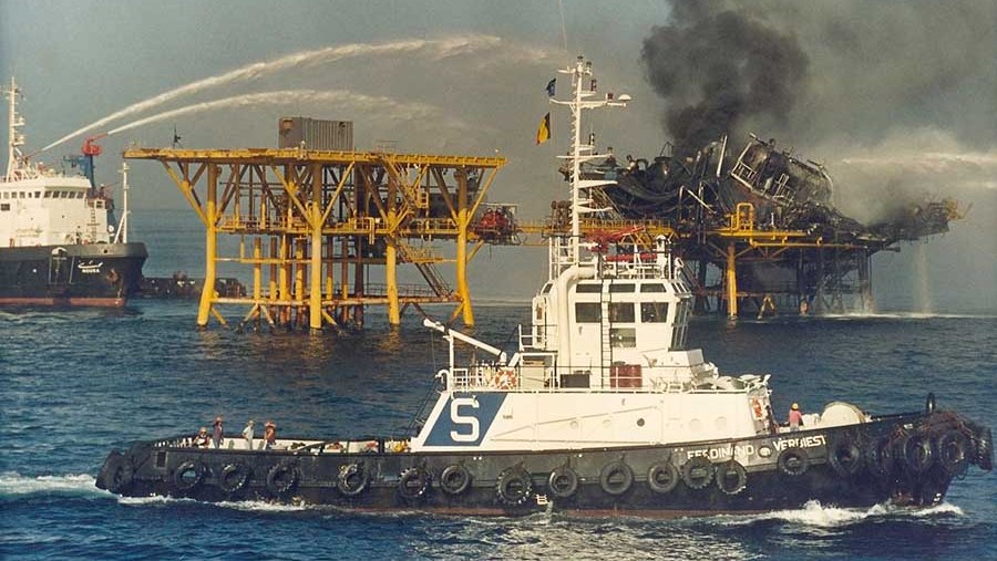 Iranian fire-fighting tugboats extinguish the blaze on the Sirri oil platform after it was attacked by U.S. warships in retaliation for the April, 14 1988 sea-mine incident, which damaged the USS Samuel B. Roberts. (Photo Norbert Schiller)
