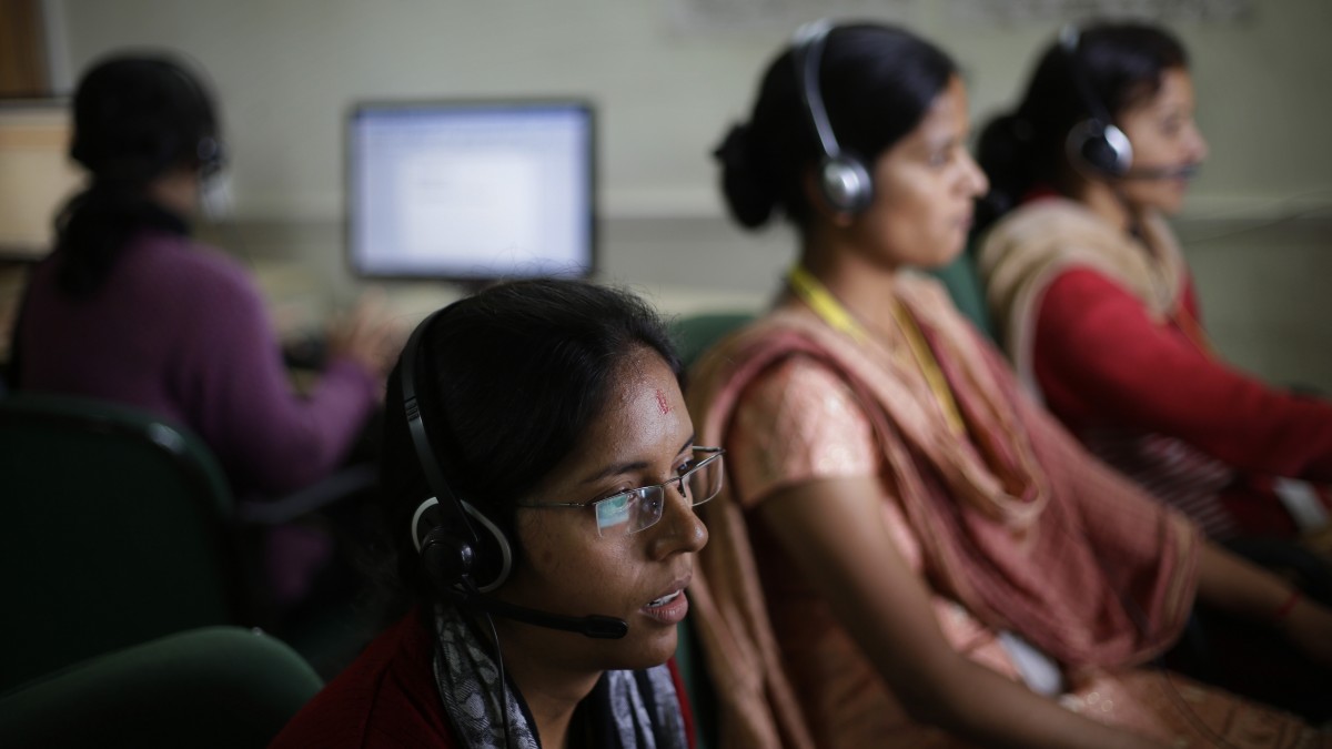 In this Aug. 23, 2012 photo, employees use headsets as they work on computers at the B2R center in Simayal, India. (AP Photo/Saurabh Das)