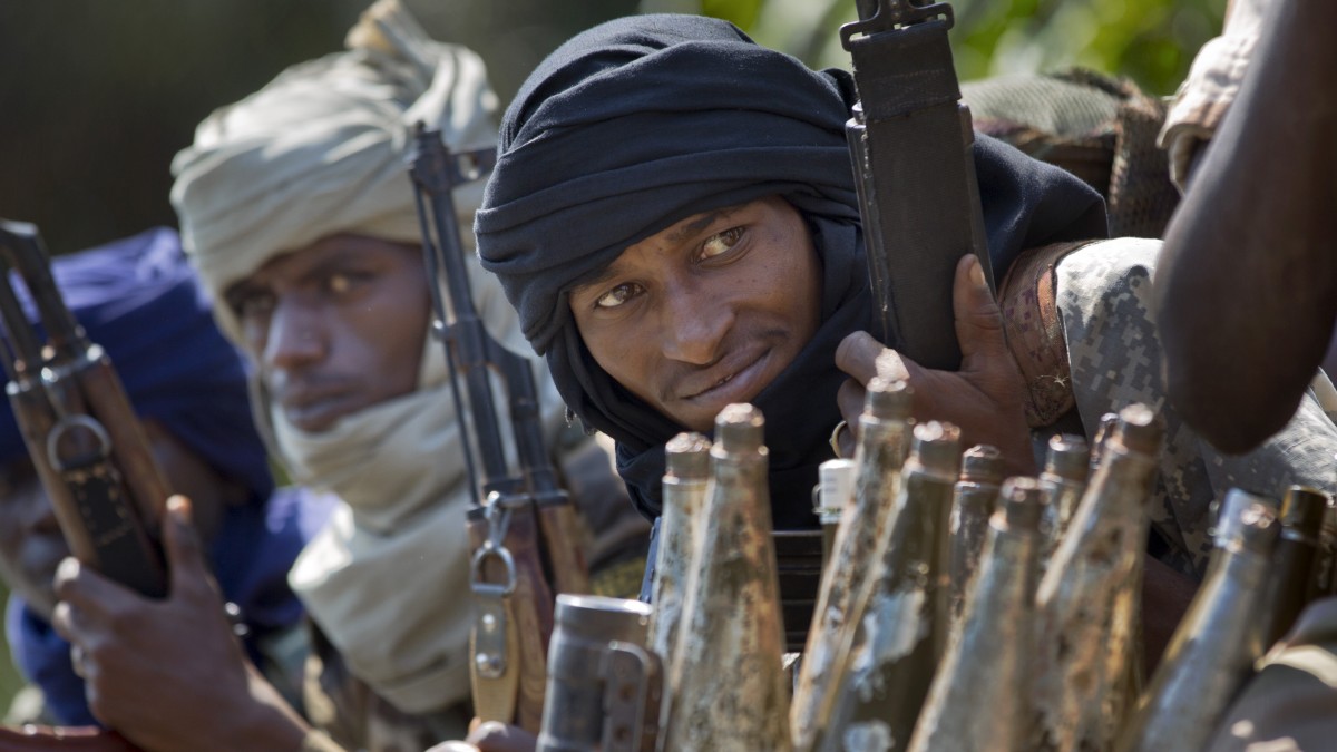 Chadian soldiers who are fighting in support of Central African Republic president Francois Bozize, sit in a truck full of rocket-propelled grenades on the road leading to Damara, about 70km (44 miles) north of the capital Bangui, Central African Republic Wednesday, Jan. 2, 2013. (AP Photo/Ben Curtis)