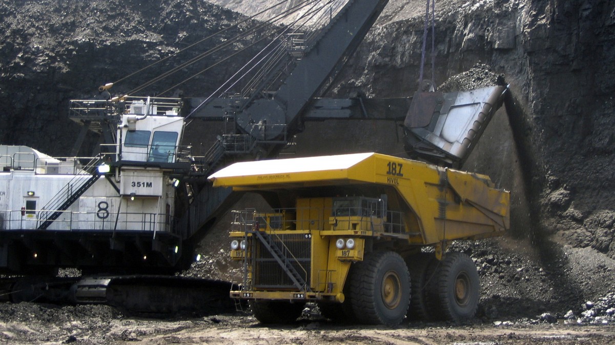 In this April 2007, file photo, a shovel prepares to dump a load of coal into a 320-ton truck at the Black Thunder Mine in Wright, Wyo. (AP Photo/Matthew Brown, File)