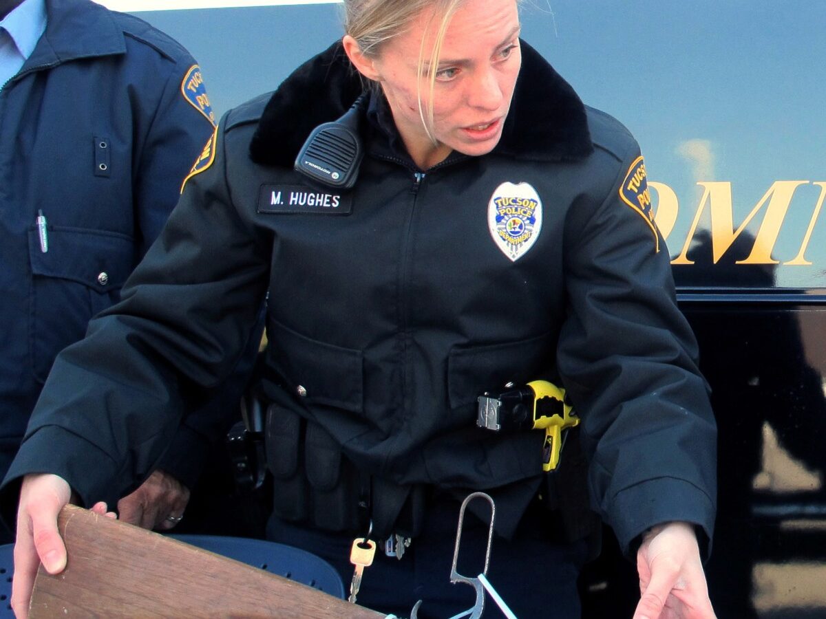Tucson police officers catalog a gun outside a police station in Tucson, Ariz. Tuesday, Jan 8, 2013 during Tucson City Councilman Steve Kozachik's gun buyback program, asking people to turn in their guns for a $50 gift certificate to a grocery store. (AP Photo/Brian Skoloff)