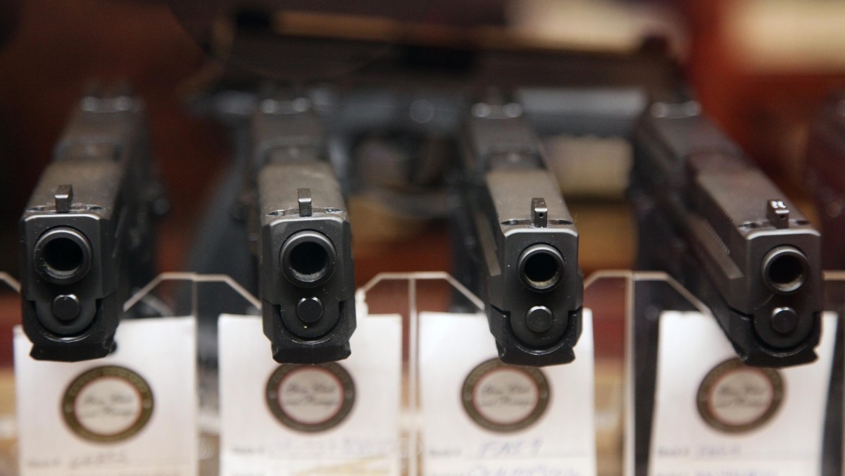In this Jan. 4, 2013 photo, handguns are displayed in the sales area of Sandy Springs Gun Club and Range, in Sandy Springs, Ga. (AP Photo/Robert Ray)
