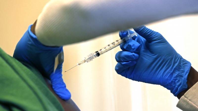 Registered nurse Charlene Luxcin administers a flu shot to a patient at the Whittier Street Health Center in Boston, Mass., Wednesday, Jan. 9, 2013. (AP Photo/Charles Krupa)