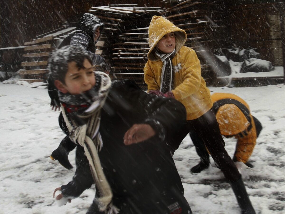 Palestinians enjoy a snowball fight in the southern West Bank village of Halhoul, Wednesday, Jan. 9, 2013. (AP Photo/Nasser Shiyoukhi)