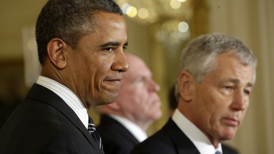 President Barack Obama listens in the East Room of the White House in Washington, Monday, Jan. 7, 2013, where he announced that he is nominating Deputy National Security Adviser for Homeland Security and Counterterrorism, John Brennan, center, as the new CIA director; and former Nebraska Sen. Chuck Hagel, right, as the new defense secretary.(AP Photo/Pablo Martinez Monsivais)