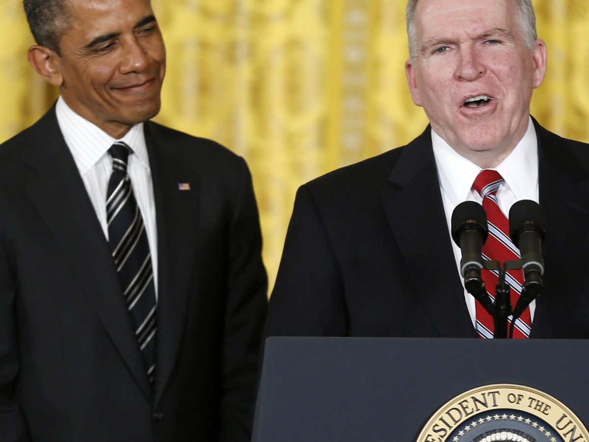 President Barack Obama and his choice for Defense Secretary, former Nebraska Sen. Chuck Hagel, left, listen as the president's choice for CIA Director, Deputy National Security Adviser for Homeland Security and Counterterrorism, John Brennan, right, speaks in the East Room of the White House in Washington, Monday, Jan. 7, 2013, where the president made the announcement. (AP Photo/Carolyn Kaster)