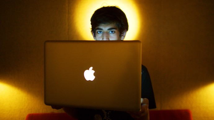 In this Jan. 30, 2009 photo, Internet activist Aaron Swartz poses for a photo in Miami Beach, Fla. Swartz was found dead Friday, Jan. 11, 2013, in his Brooklyn, N.Y., apartment, according to Ellen Borakove, spokeswoman for New York's medical examiner. (AP Photo/The New York Times, Michael Francis McElroy)