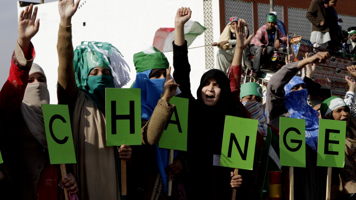 Supporters of Pakistani cleric Tahir-ul-Qadri chant anti-government slogans at a rally en-route to Islamabad, in Jhelum, Pakistan, Monday, Jan. 14, 2013. (AP Photo/K.M. Chaudary)