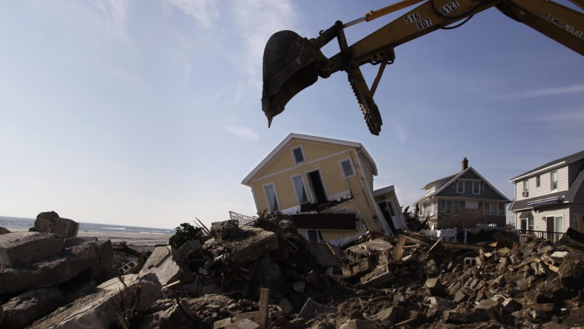In this Nov. 29, 2012, file photo, clean-up from superstorm Sandy continues on the site of a demolished home on the Rockaway peninsula in the Queens borough of New York. (AP Photo/Seth Wenig, File)