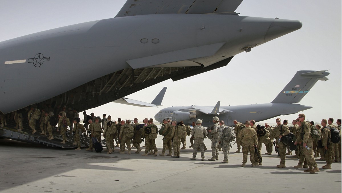 In this July 14, 2011, file photo, U.S. soldiers board a U.S. military plane, as they leave Afghanistan, at the U.S. base in Bagram north of Kabul, Afghanistan. (AP Photo/Musadeq Sadeq, File)