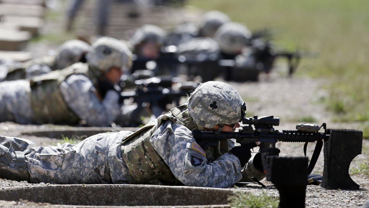 In this Sept. 18, 2012 file photo, female soldiers from 1st Brigade Combat Team, 101st Airborne Division train on a firing range while testing new body armor in Fort Campbell, Ky., in preparation for their deployment to Afghanistan. (AP Photo/Mark Humphrey, File)