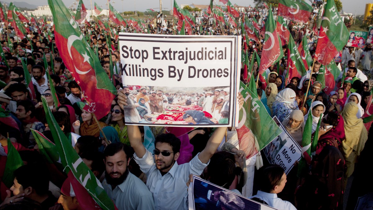 Supporters of Pakistani cricketer-turned-politician Imran Khan rally to condemn U. S. drone attacks in Pakistani tribal areas on al-Qaida and Taliban hideouts, in Islamabad, Pakistan, Friday, Oct 28, 2011. (AP Photo/B.K.Bangash)