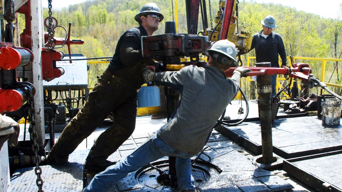 Workers move a section of well casing into place at a Chesapeake Energy natural gas well site near Burlington, Pa. in Bradford County Friday, April 23, 2010. (AP Photo/Ralph Wilson)