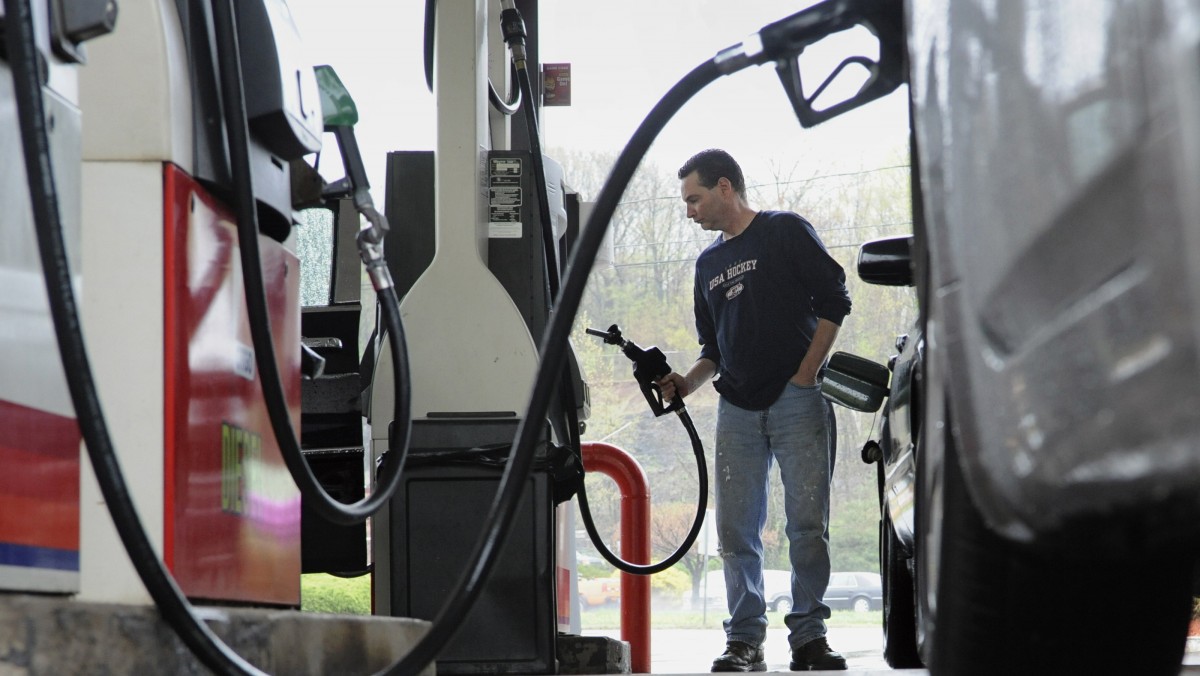 John Magel of Wetherfield pumps gas at a CITGO station in Wethersfield, Conn., Thursday, April 28, 2011. (AP Photo/Jessica Hill)