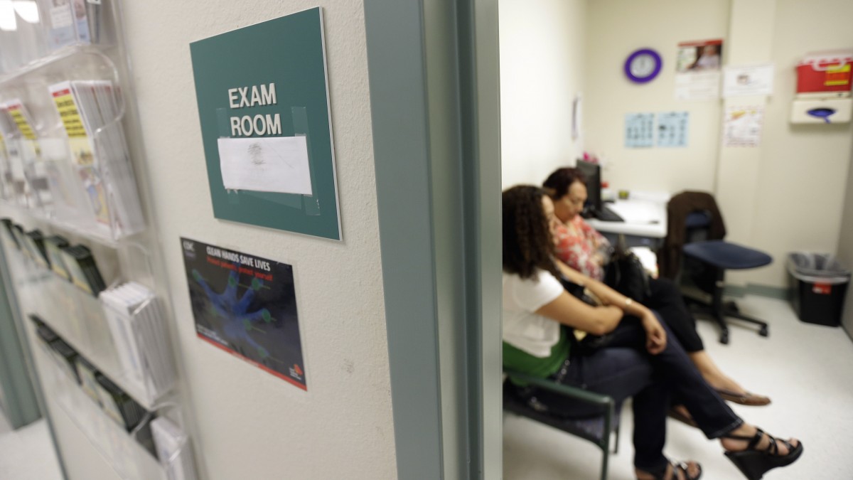In this July 12, 2012 photo, two women wait in an exam room at Nuestra Clinica Del Valle, in San Juan, Texas. (AP Photo/Eric Gay)