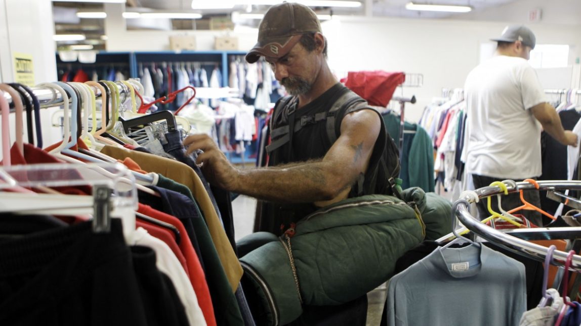 George Lamb, a homeless man, looks for used clothes at Sacred Heart Community Center in San Jose, Calif., Thursday, Sept. 16, 2010. (AP Photo/Marcio Jose Sanchez)