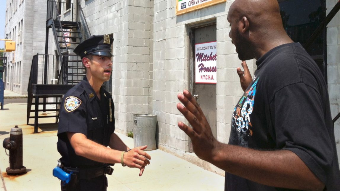 Det. Anthony Mannuzza, left, and Police Officer Robert Martin, right, simulate a street stop during a training session on Wednesday, June 20, 2012 at the New York Police Department's (NYPD) training facility in Rodman's Neck, in the Queens borough of New York. (AP Photo/Colleen Long)