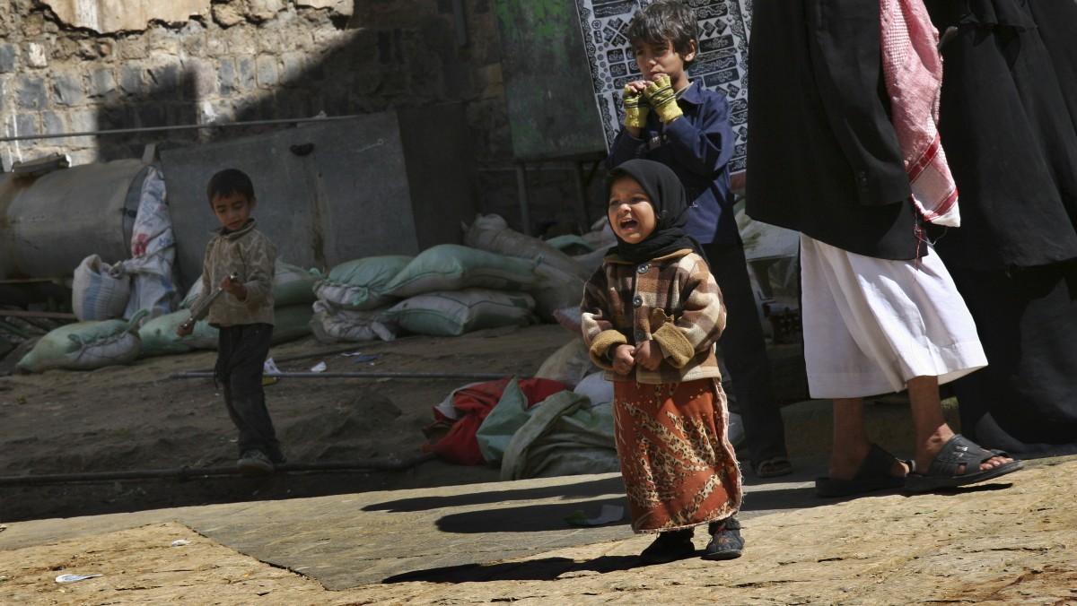 Young children, whose parents were nearby busking for money, play in the streets of the Bab al-Yemen area of the capital San'a, Yemen, Dec. 3, 2008. (AP Photo/Paul Schemm)