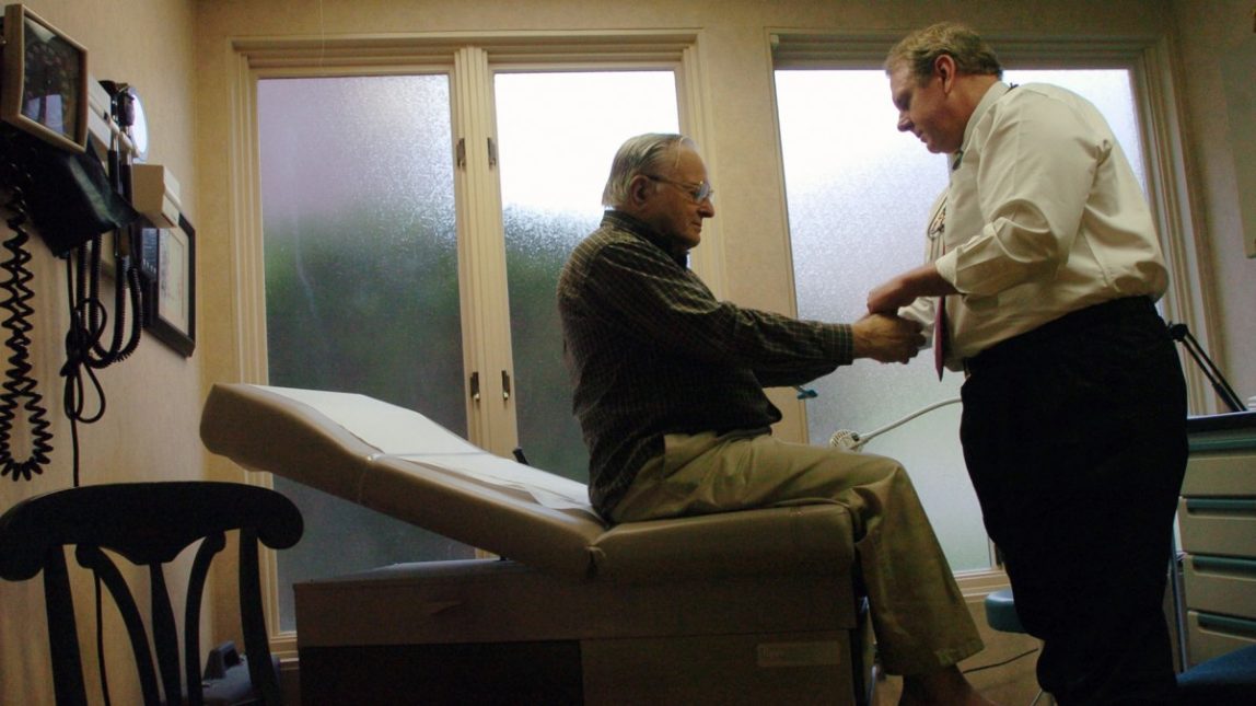 Dr. Winslow Murdoch, right, examines patient Joseph Balinski at his West Chester, Pa.. Murdoch doesn't accept any insurance and instead has patients pay him a monthly retainer in an arrangement commonly referred to as a "concierge practice." (AP Photo/Bradley C. Bower)