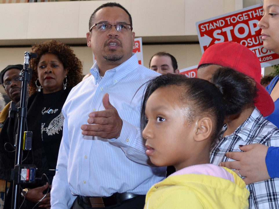 Representative Keith Ellison D FL MN addresses Occupy Homes rally. Rose McGee (left) is fight to save her home from banks