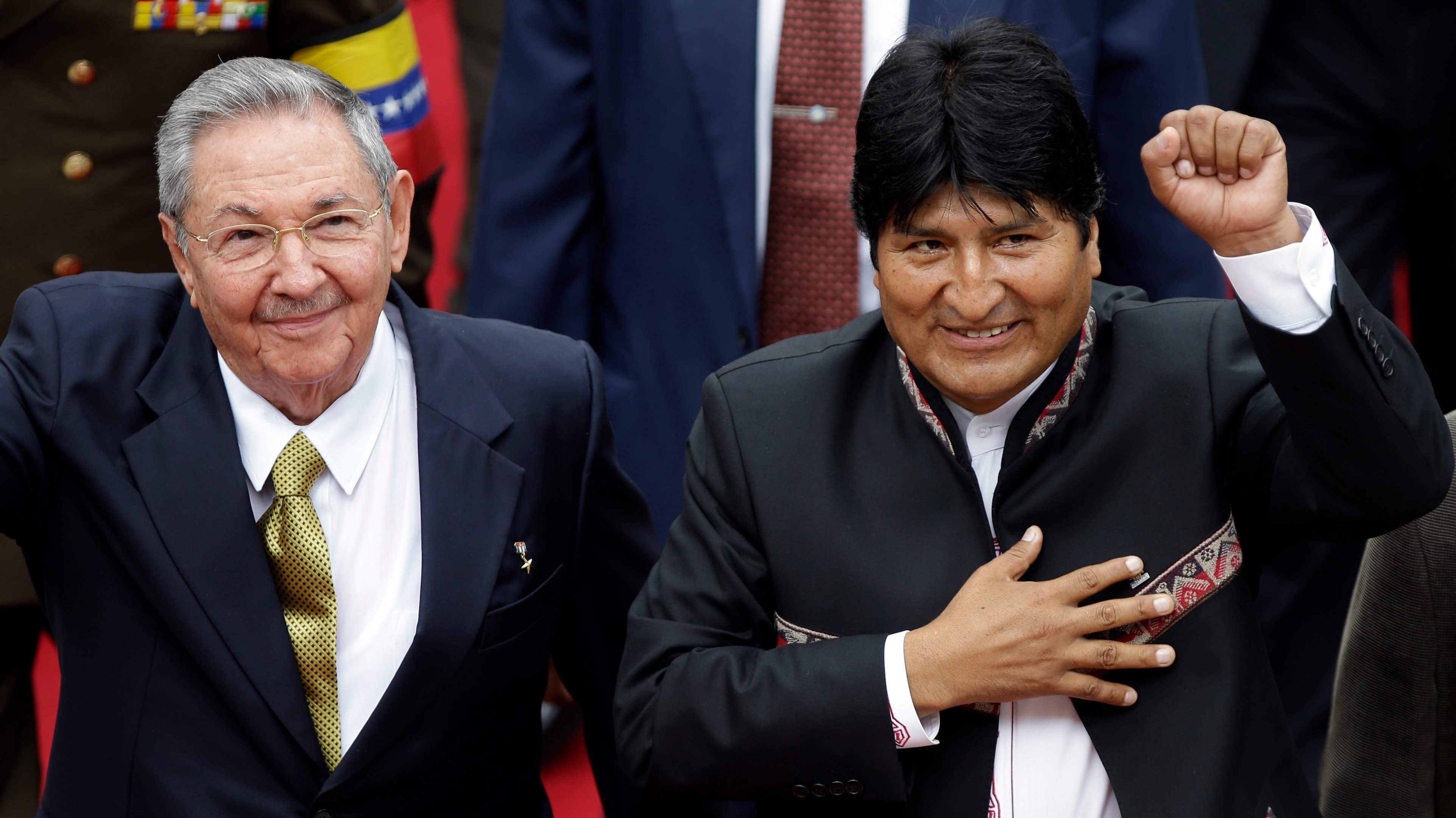 Bolivian President Evo Morales arrives to the National Assembly with Cuba's Raul Castro for the inauguration of Venezuela's President-elect Nicolas Maduro in Caracas, Venezuela, Friday, April 19, 2013. Morales said Wednesday he is expelling the U.S. Agency for International Development from Bolivia for allegedly seeking to undermine his leftist government.  (AP Photo/Fernando Llano)