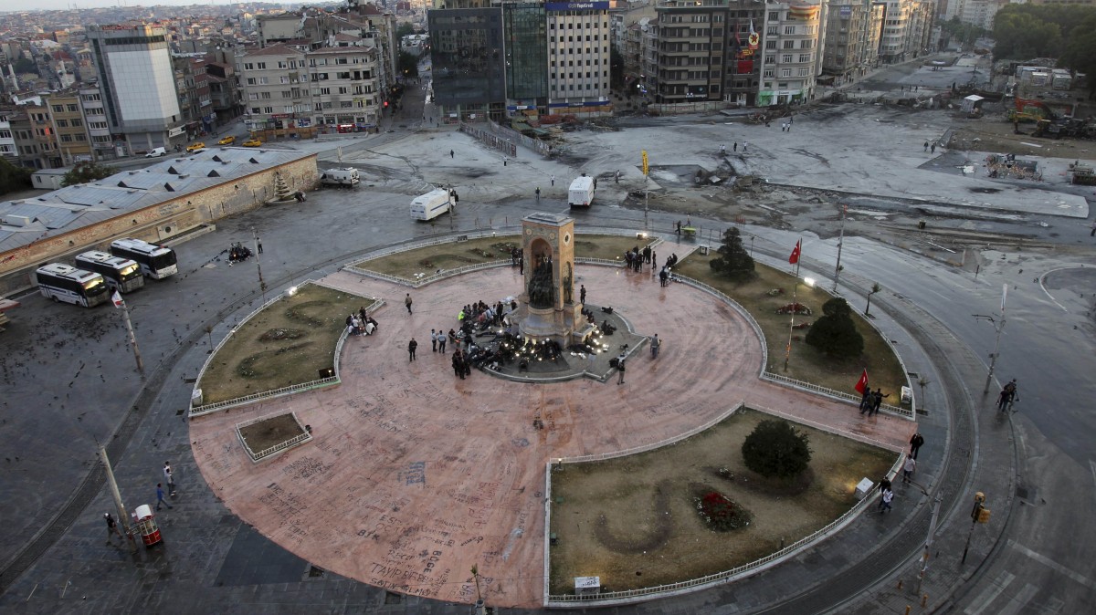 Istanbul's central Taksim Square sits vacant after police clash with protesters. (AP Photo/Thanassis Stavrakis)