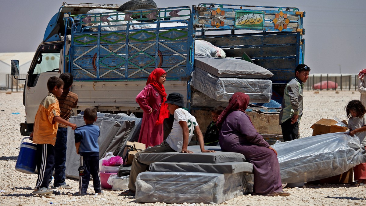 Syrian refugees take down their belongings at Zaatari refugee camp, in Mafraq, Jordan. (AP/Mohammad Hannon)