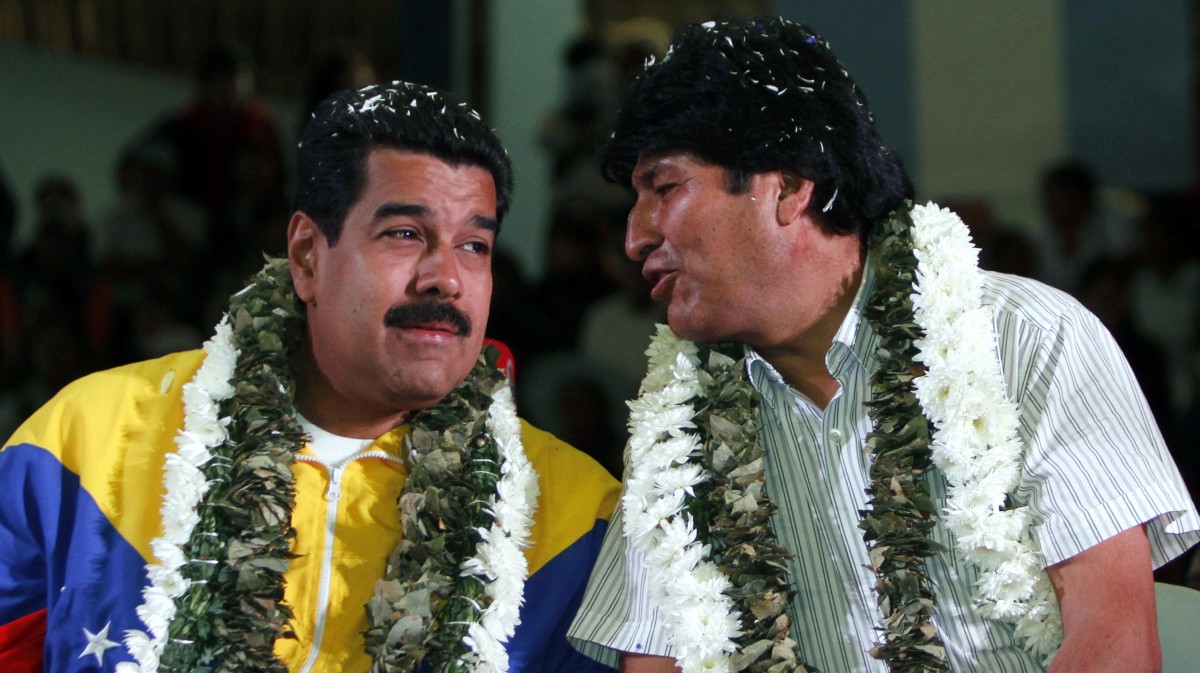 Venezuela's President Nicolas Maduro, left, talks with Bolivia's President Evo Morales during a welcome ceremony for presidents attending a meeting in Cochabamba, Bolivia, July 4, 2013. (AP/Juan Karita)