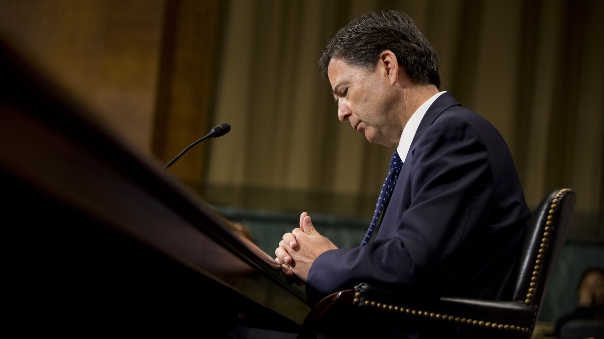 FBI Director nominee James Comey pauses as he testifies on Capitol Hill in Washington