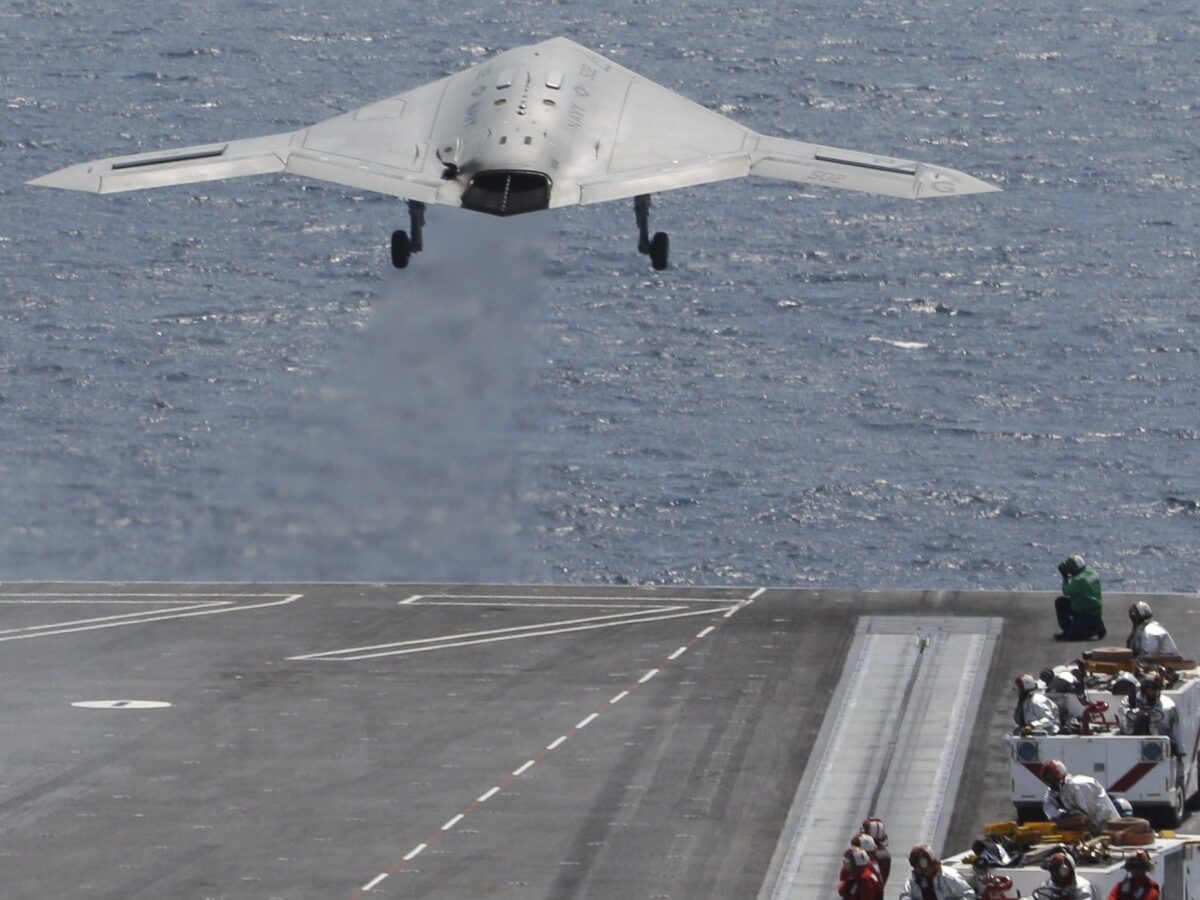 A X47-B Navy Drone is launched from the deck of the nuclear aircraft carrier USS George H. W. Bush off the Coast of Virginia Wednesday, July 10, 2013. It is the first landing by a drone on a Navy carrier. (AP Photo/Steve Helber)