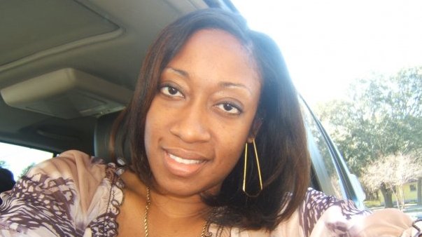 This photo shows Marissa Alexander in her car in Tampa, Fla. Alexander had never been arrested before she fired a bullet at a wall one day in 2010 to scare off her husband when she felt he was threatening her. Nobody got hurt, but this month a northeast Florida judge was bound by state law to sentence her to 20 years in prison. (AP Photo/Lincoln B. Alexander)