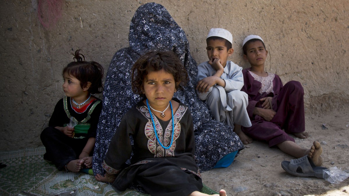 Masooma sits with her children at her brother-in-law's house on the outskirts of Kandahar, Afghanistan on Saturday, April 20, 2013. In an interview, Masooma recounted the events of pre-dawn March 11, 2012 when a U.S. soldier rampaged through two villages killing 16 people, including her husband. (AP Photo/Anja Niedringhaus)