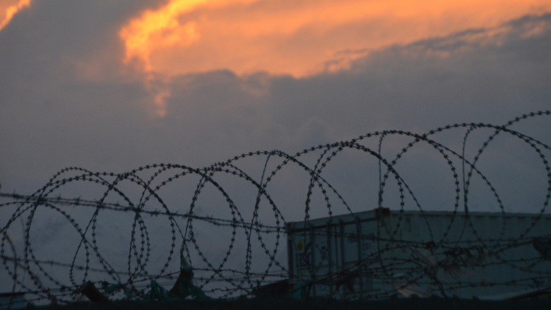 The sun sets over the Bagram Airfield in Afghanistan, whose detention center has been dubbed "the other Guantanamo." (Photo/401st_AFSB via Flickr)