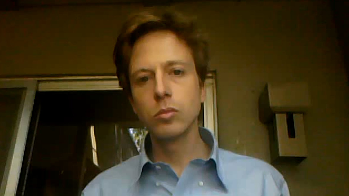 Barrett Brown, pictured, was facing a slew of charges for his alleged involvement with the hacktivist group Anonymous. (Photo/screen grab via YouTube)
