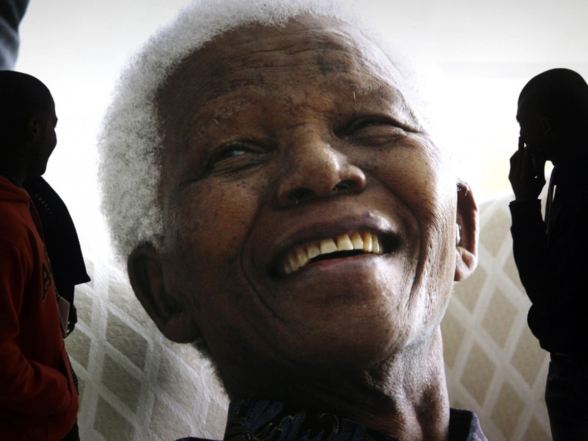 In this June 27, 2013 file photo, giant photographs of former South African President Nelson Mandela are displayed at the Nelson Mandela Legacy Exhibition at the Civic Centre in Cape Town, South Africa. (AP Photo, File)