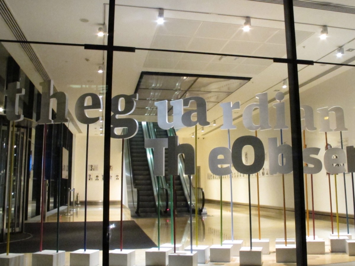 A display fronts the offices of the Guardian and its sister paper, The Observer, on the night on Monday, August 19, 2013.  (AP/Raphael Satter)