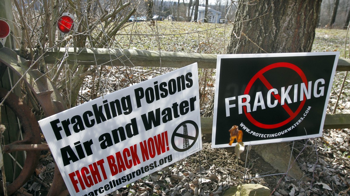 In this Feb. 23, 2012 file photo, signs opposing the hydraulic fracturing process of drilling for gas, or "fracking" are posted in Evans City, Pa. (AP Photo/Keith Srakocic, Fil