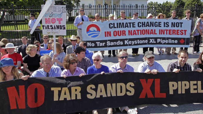 Environmental activists gather outside the White House in Washington, Monday, Aug. 22, 2011, as they continue a civil disobedience campaign against a proposed oil pipeline from Canada to the U.S. Gulf Coast, in Washington. The protesters want President Barack Obama to deny a permit for the 1,700-mile Keystone XL pipeline that would take oil extracted from tar sands in Alberta, Canada, and carry it through a pipeline cutting across Montana, South Dakota, Nebraska, Kansas, Oklahoma and Texas to refineries in Houston and Port Arthur, Texas.   (AP Photo/J. Scott Applewhite) (AP Photo/J. Scott Applewhite)