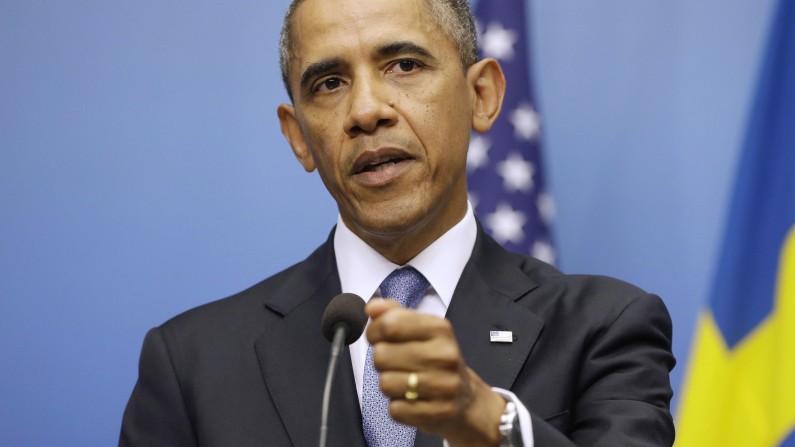 President Barack Obama gestures during his joint news conference with Swedish Prime Minister Fredrik Reinfeldt, Wednesday, Sept. 4, 2013, at the Rosenbad Building in Stockholm, Sweden. The president said international community and Congress credibility on the line on response to Syria . (AP Photo/Pablo Martinez Monsivais)